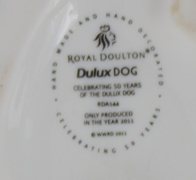 A Royal Doulton Dulux Dog miniature figure, Celebrating 50th Years of the Dulux Dog, dated 2011, stamped RDA144, 14cm high. - 2