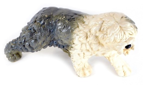 A Goebel pottery Old English Sheepdog, in walking pose, 23cm high, 41cm wide.