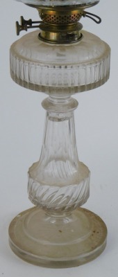 An early 20thC cut glass oil lamp, with an oval reservoir on a shaped and twist stem, on circular foot with diamond pressed shade and chimney, 59cm high. (AF) - 2