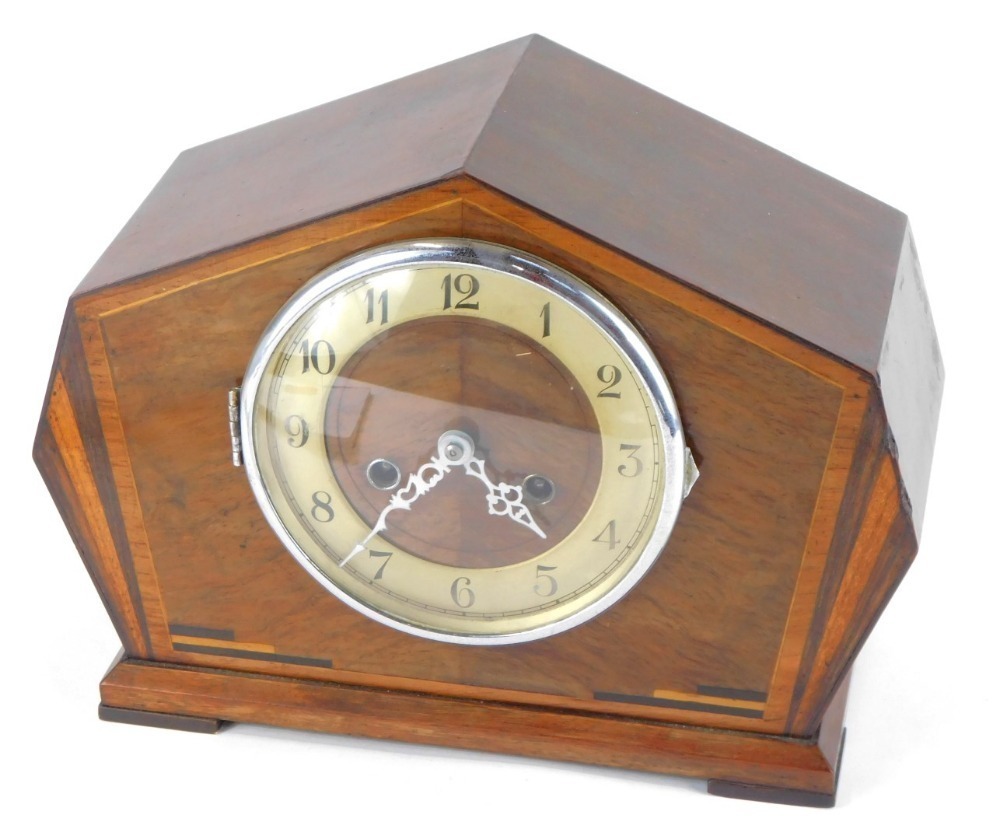 A 1950s Art Deco style walnut cased mantel clock, with a moulded case ...