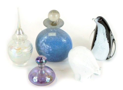 A group of Art Glass, comprising a Gozo glass perfume bottle, 11cm high, a purple mirrored glass scent bottle, 7cm high, an iridescent glass perfume bottle with ribbed white design and elaborate stopper, 16cm high, a Scottish Borders Art Glass penguin pa