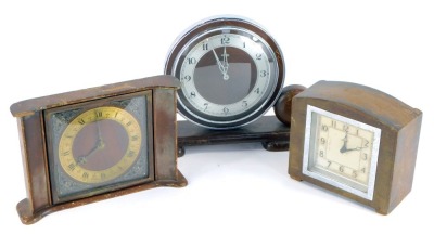 Three Art Deco mantel clocks, comprising an oak and silver rimmed numeric Metamec mantel clock, 21cm high, 28cm wide, a square set Enfield mantel clock, with square silvered numeric dial, 14cm high, and an oak cased mantel clock, with brass chapter ring a