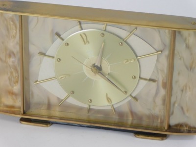 A Metamec 1950s/60s mantel clock, with a central eye design dial, with baton dial, with a mother of pearl style finish in brass outer casing, 15cm high, 28cm wide. - 2