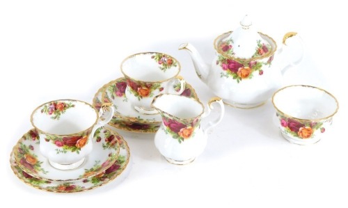 A group of Royal Albert Old Country Roses porcelain tea wares, comprising two cups and saucers, two side plates, milk jug, sugar bowl, and teapot.