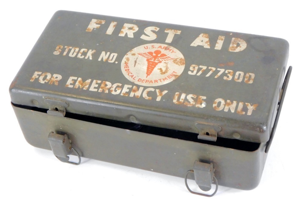 A US Army Military First Aid Kit, stock number 9777300, opening to