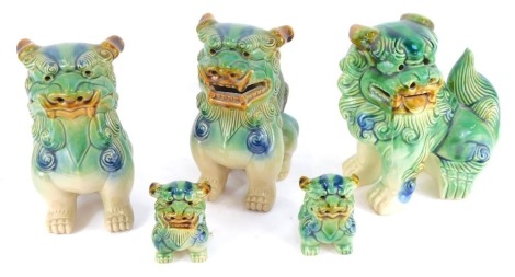 Five Chinese dogs of fo ornaments, comprising three large 22cm high, and two small 10cm high. (5)