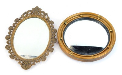 Two 19thC and later mirrors, comprising a gilt framed convex mirror, 25cm diameter, and a gilt shell capped wall mirror, 30cm high, 22cm wide. (2)