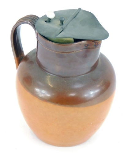 A Royal Doulton stoneware jug, with two tone brown treacle glazed design, and a pewter hinged lid, , 17cm high.