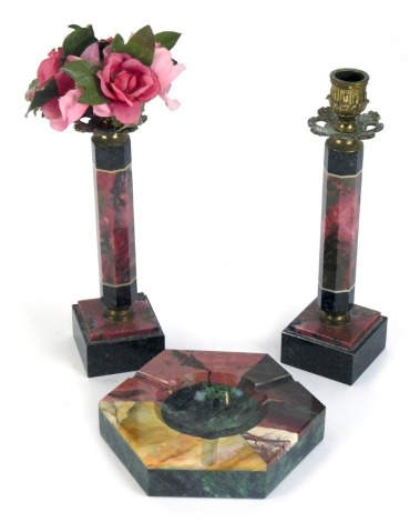 A brass, serpentine and marble candlesticks, of hexagonal form, raised on a stepped, square base, together with a hexagonal ashtray, 14cm diameter. (3)