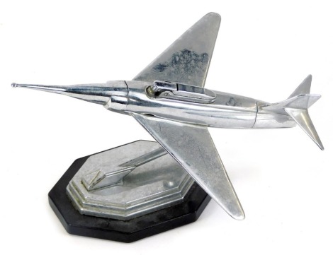 An Art Deco style chrome aeroplane modelled cigarette lighter, on a shaped and ebonised base, 17cm high.