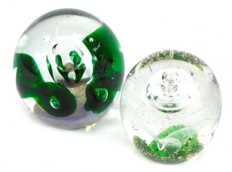 Two 20thC glass dump paperweights, comprising a green and purple bubble weight, 12cm high, and another with green and white design, 11cm high. (2)