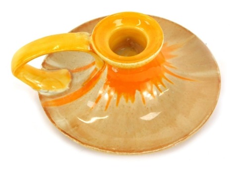 A Shelley two tone chamberstick, of circular form in an orange and yellow drip glaze, printed mark, 7cm high.