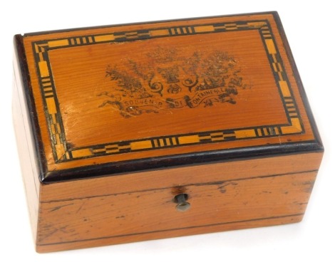 A French wooden souvenir box, inscribed Souvenir de Fontainebleau, with hinged side panel, 5cm high, 9.5cm wide, 6cm deep.