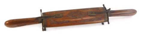 An Indian carving set, in a teak carved case, with fork and knife, in a carved sheath, stamped to blade India, 45cm wide.