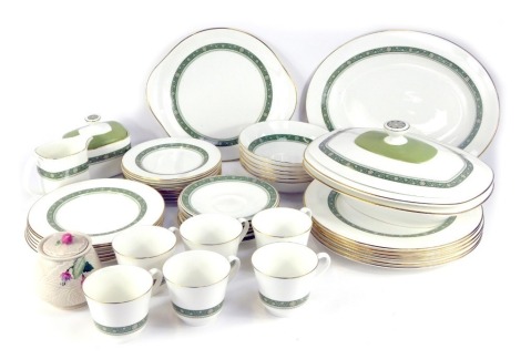 A Royal Doulton Rondelay pattern porcelain part dinner and tea service, pattern no H5004, comprising milk jug, sugar bowl, meat plate, six dinner plates, six tea cups and saucers, six bowls, two tureens with one lid, milk jug saucer, cake plate, eight sid