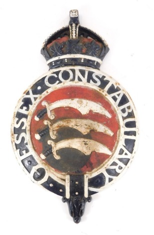 An Essex Constabulary cast iron plaque, painted in red, blue and white with the arms of Essex, within a garter, and crown surmount, 49cm high, 29cm wide.