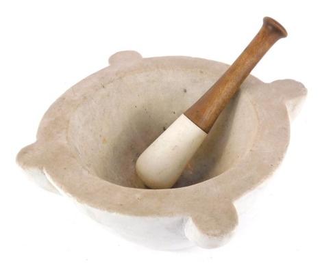 A marble pestle and mortar, of lobed circular form, and a turned wooden mortar, 17cm high, 31cm diameter.