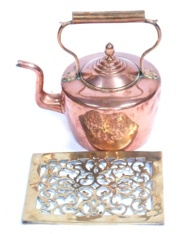 A Victorian copper kettle, 33cm high, and a brass pierced brass teapot stand, 28cm x 21cm. (2)