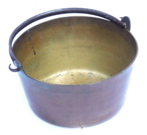 A brass jam pan, with cast iron handle, 30cm wide.