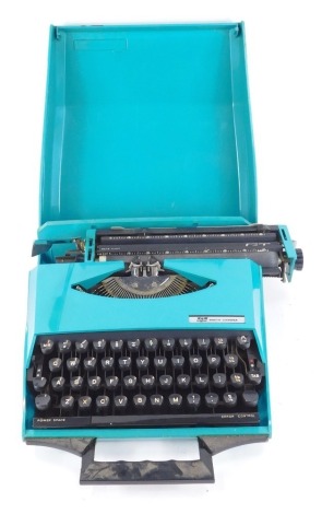 A Smith Corona GT cased portable typewriter, in turquoise case, 27cm wide, 40cm deep.