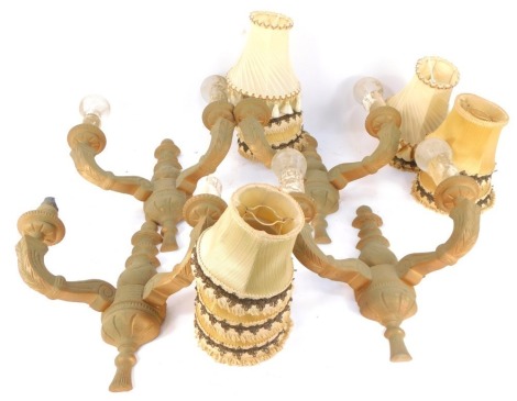 A set of four giltwood two branch wall lights, each with sconce and shade, 33cm high, 30cm wide.