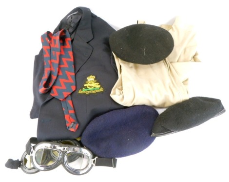 Gentleman's clothing, comprising an Austin Reid black suit jacket, with Royal Artillery badge, a grey gentleman's overcoat, two pairs of aviation goggles, a beret, tie, black beret with cap badge, and a plain black beret. (7)