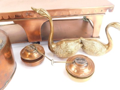 A 19thC copper plate warmer, with a fluted top, on rectangular base, with burners, 17cm high, 62cm wide, 24cm deep, a Victorian copper kettle, and two brass swans. (4) - 2