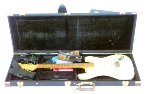 A Tokai Goldstar Sound electric guitar, in fitted carry case, with straps, stand, and a Ross amplifier, the case 9cm high, 106cm wide, 39cm deep.