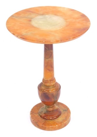 An Italian onyx side table, with a circular top, on a baluster column support with circular base, 52cm high, 36cm diameter.