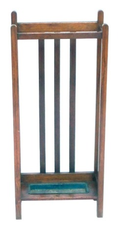 An Edwardian mahogany stick or umbrella stand, with a metal drip tray, 81cm high, 35cm wide, 17cm deep.