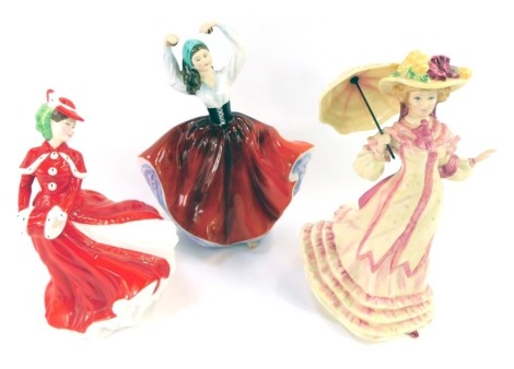 Three Royal Doulton porcelain ladies, comprising Springtime HN3477, Karen HN2388 and Christmas Celebrations HN4721, each 20cm high. (AF) (3)