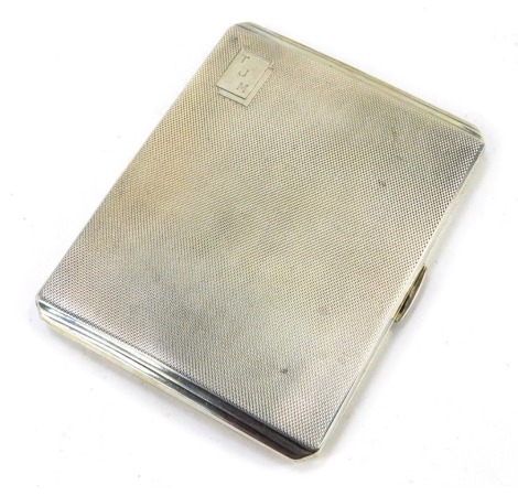 A George VI silver cigarette case, with engine turned design with two rectangular cartouche panels bearing the initials TJM, Birmingham 1939, 4.87oz.