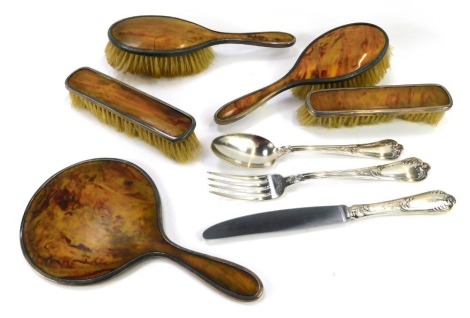 George V and later silver dressing table wares, comprising an imitation tortoiseshell five piece silver dressing table set, comprising pair of clothe brushes, pair of hair brushes and a hand held mirror, and three pieces of Sambonet plated cutlery.