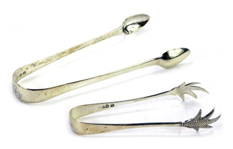 A pair of George III silver sugar tongs, John Lias, London 1816, and a pair of Edward VII silver sugar nips, Chester 1909, 1.51oz. (2)