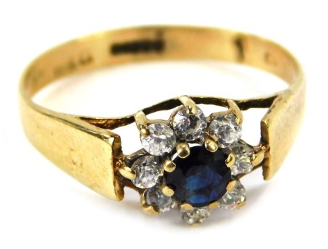 A 9ct gold floral cluster ring, set with central blue and white stones, ring size K½, 1.5g all in, boxed.