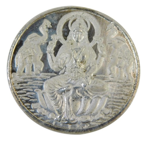 An Indian silver Lakshmi coin.