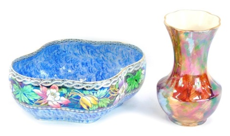 Two items of lustre pottery, comprising a red lustre finish vase, with a fluted gilt rim, stamped Port Ware, 17cm high, and a Maling lustre blue floral bowl, 9cm high, 24cm wide. (2)