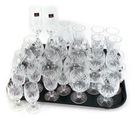 A group of crystal drinking glasses, comprising a pair of Royal Doulton champagne flutes, a set of six high ball glasses, six sherry glasses, and various others. (1 tray)