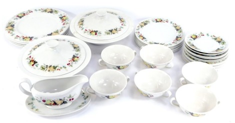 A Royal Doulton Miramont pattern porcelain part dinner service, comprising five dinner plates, two tureens and covers, six soup cups, six saucers, six side plates, gravy boat and saucer, and six dessert plates. (1 tray and a quantity)