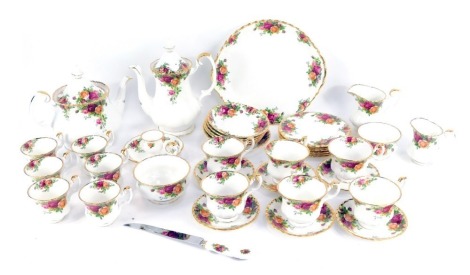 A Royal Albert Old Country Roses porcelain part tea and coffee service, comprising coffee pot, teapot, butter knife, cake plate, candle stand, large milk jug, small milk jug, sugar bowl, six small saucers, six large saucers, six side plates, six large tea