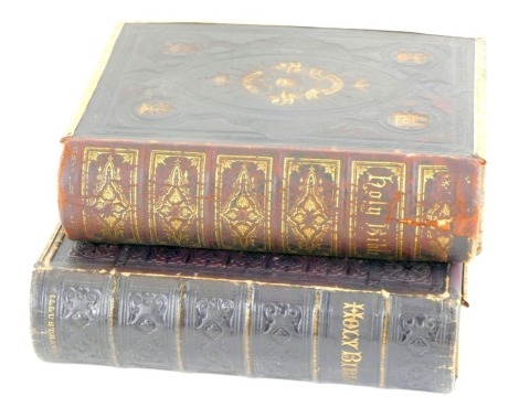 Two gilt and leather bound Holy Bibles, gilt tooled with brass clasps.