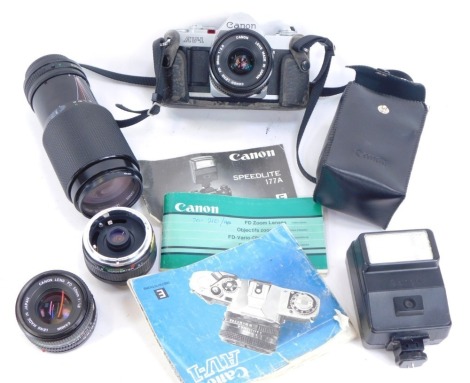 A Canon SLR camera, Canon Tokina lens, instruction book, etc. (a quantity)