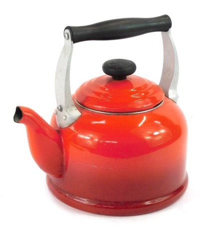 A Le Crueset red kettle, 23cm high.