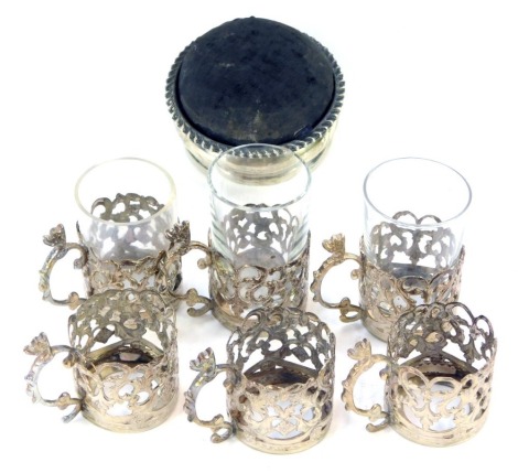 A small collection of silver, comprising six Edward VII silver shot glass holders, with three glasses, Chester 1970, and a silver pin cushion trinket box, hallmarks rubbed, 4.78oz gross.