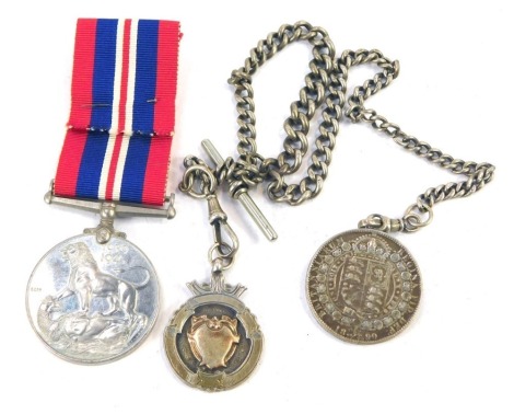 A silver curb link watch Albert chain, with T bar and two clasps as fitted, one holding and silver and gilt medallion, the other a Victorian half crown, 1890, 58.1gm together with a WWII 1939-45 war medal.