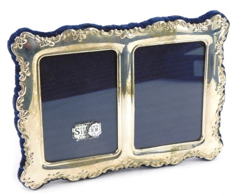 An Elizabeth II silver double strut photograph frame, embossed with flowers, apertures 8 x 5.5cm each, boxed, Carrs of Sheffield, Sheffield 1996.