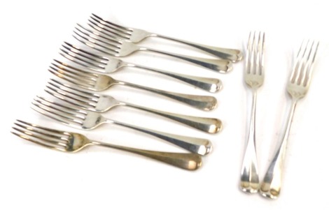 Nine George V/Edward VIII silver Old English pattern dessert forks, Sheffield 1932, 1934, 1936, 13.87oz.