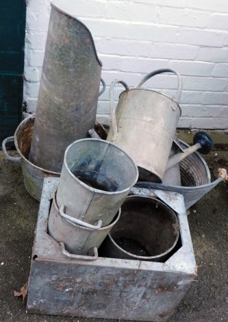 A group of galvanized wares, comprising watering cans, buckets, planter, etc. (a quantity)