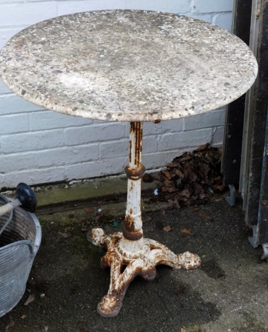 A cast iron and marble circular pub table, on a white painted base, with circular marble top, 70cm high, 64cm diameter.