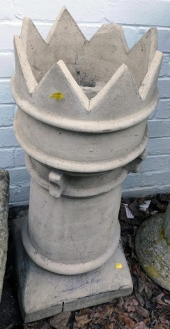 A Victorian chimney pot, with turreted top, on a square base, 78cm high.